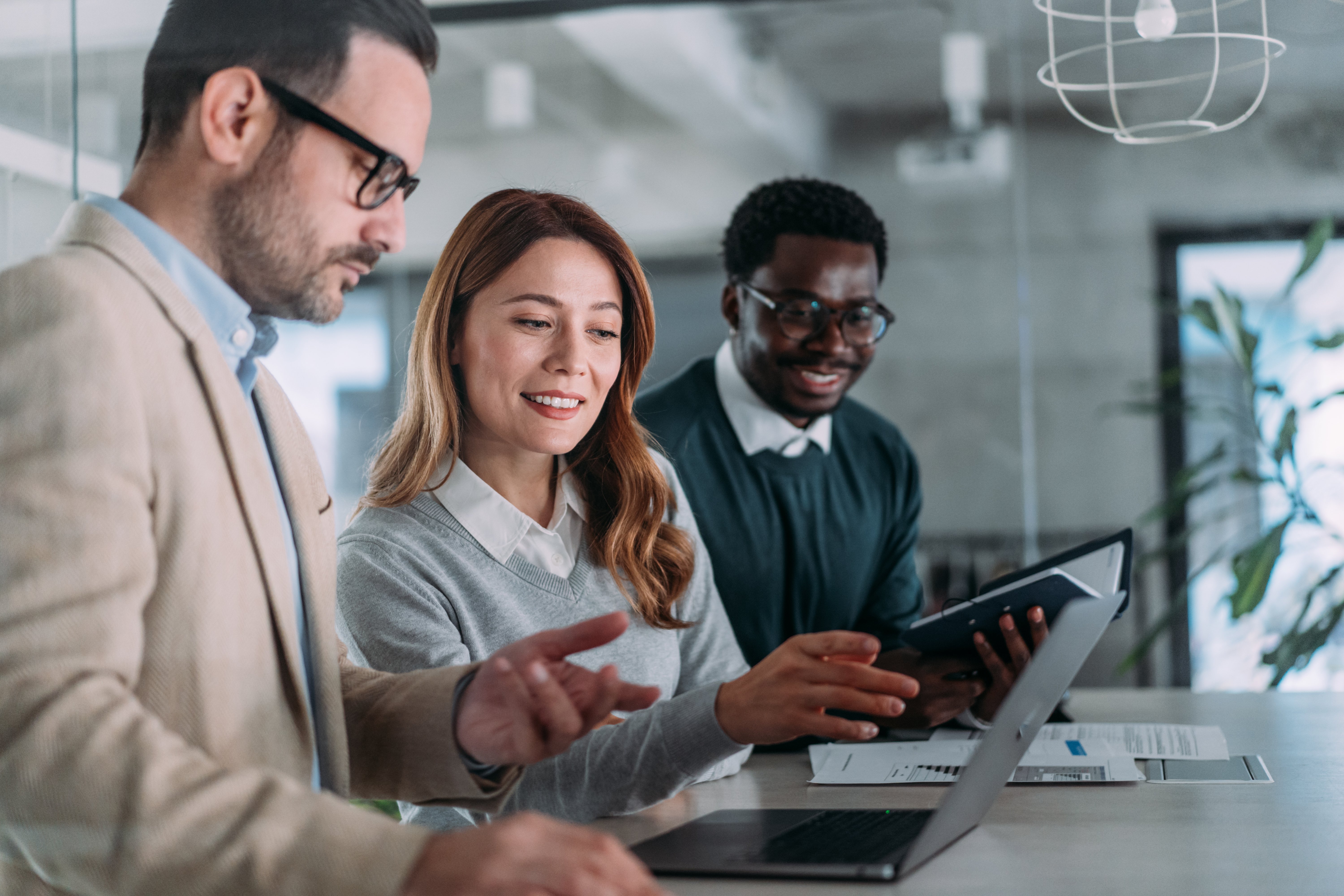 business-woman-explaining-business-plan-on-laptop-2201993882