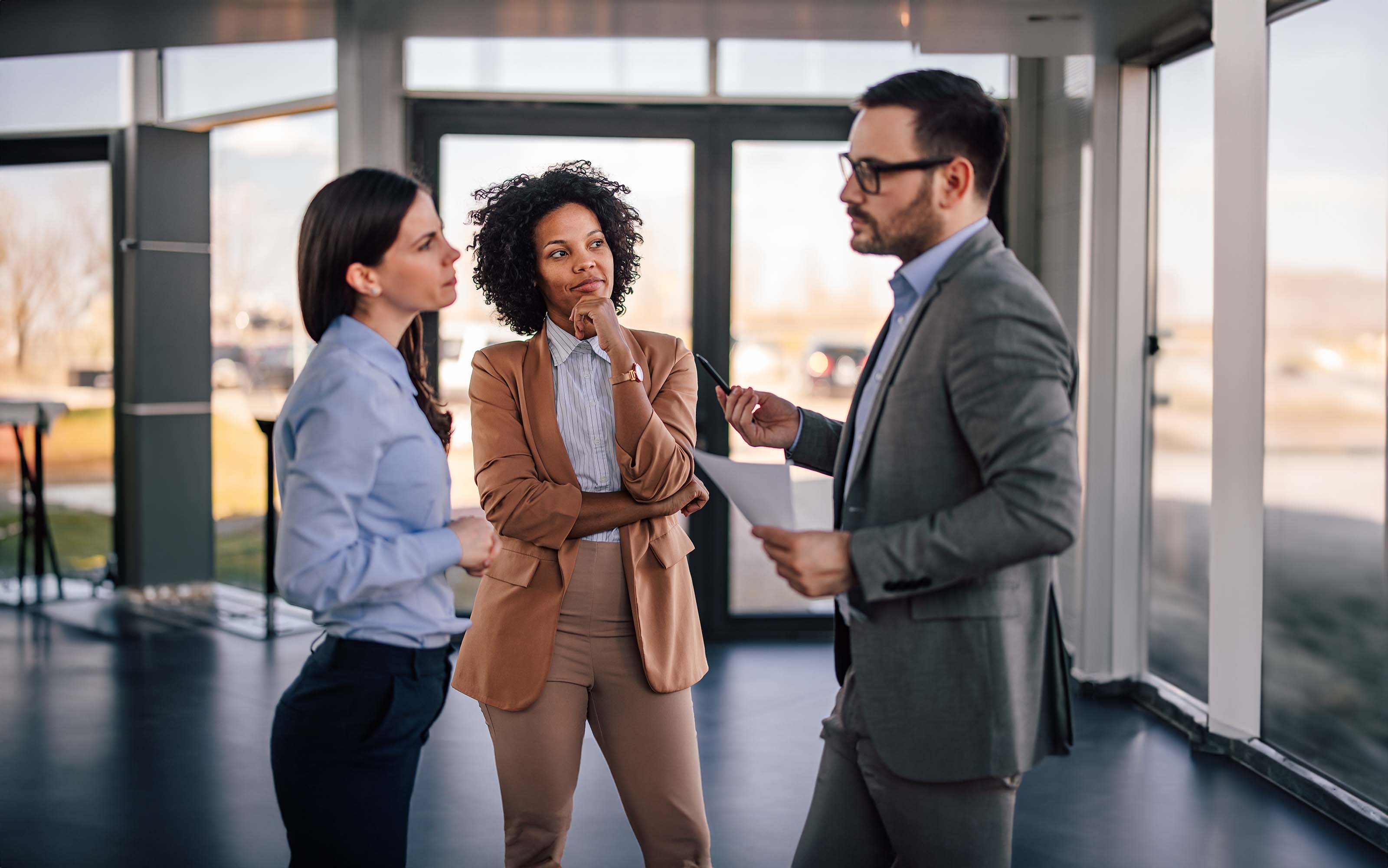 businesspeople-standing-in-company-hall-1382905680