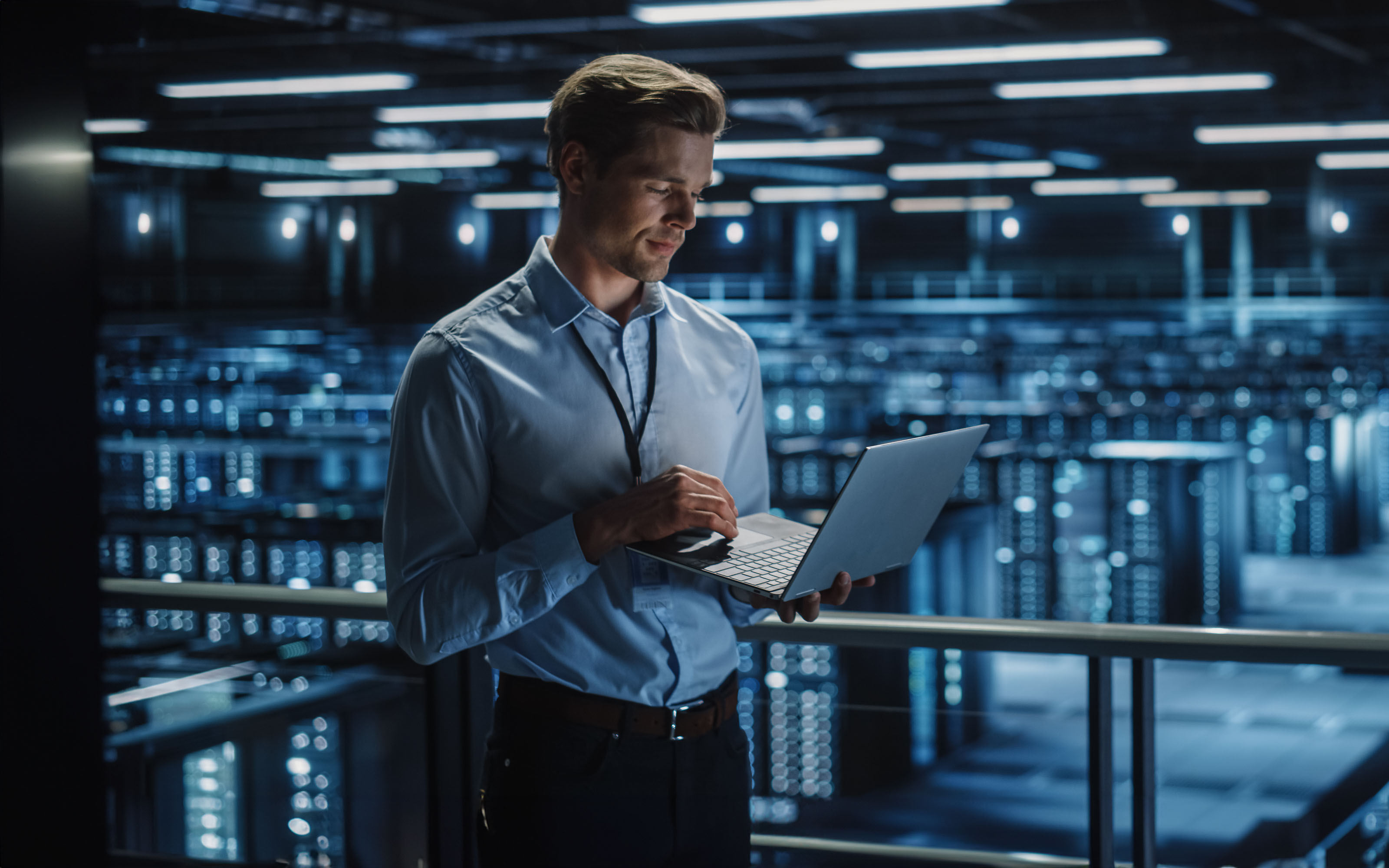 data-center-specialist-engineer-using-laptop-1336250742