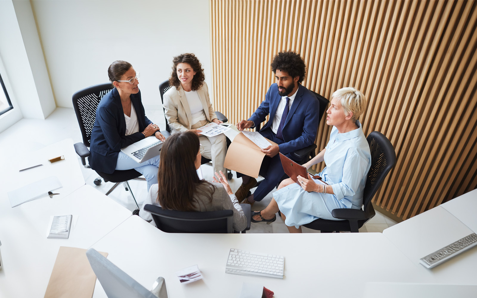 employees-in-business-meeting-1071488224