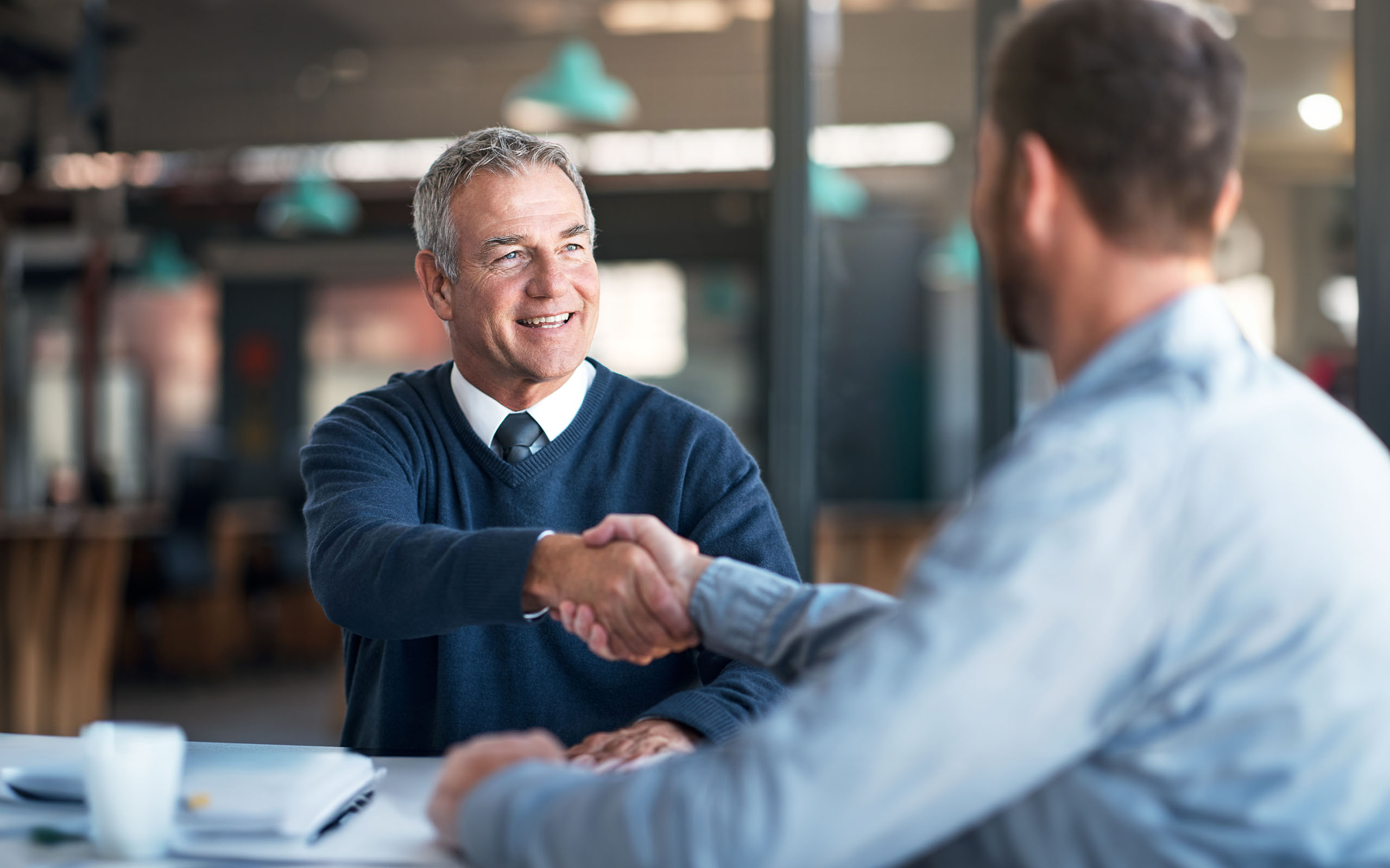 businessman-shaking-hands-1185859198
