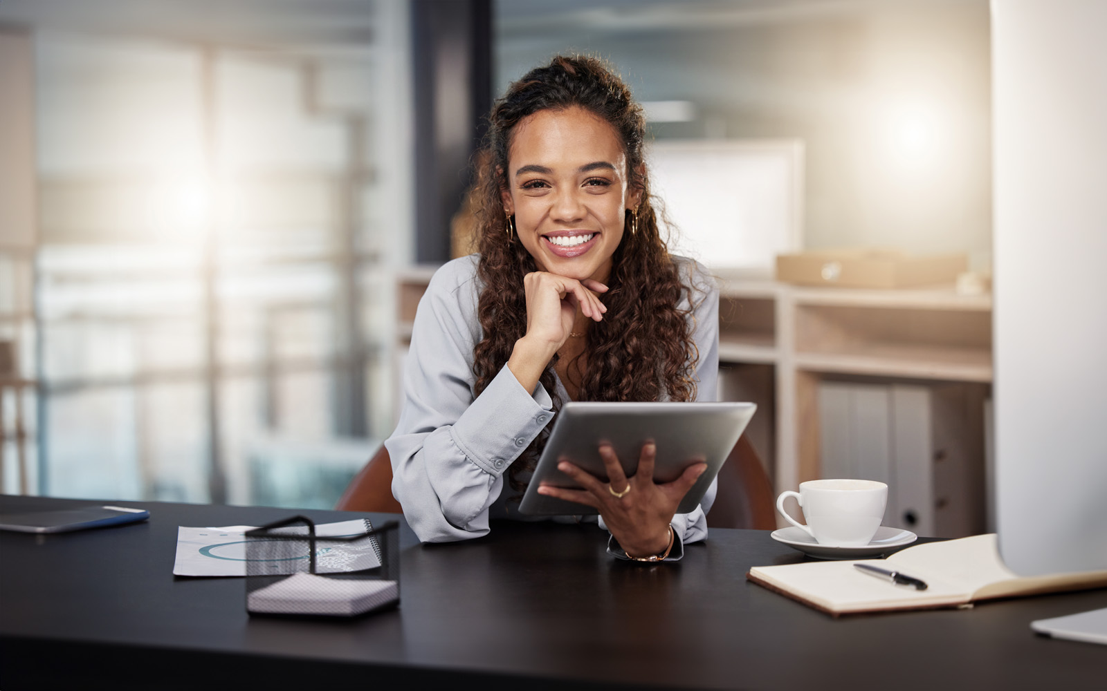 shot-of-a-young-businesswoman-using-a-digital-tablet-1365606632