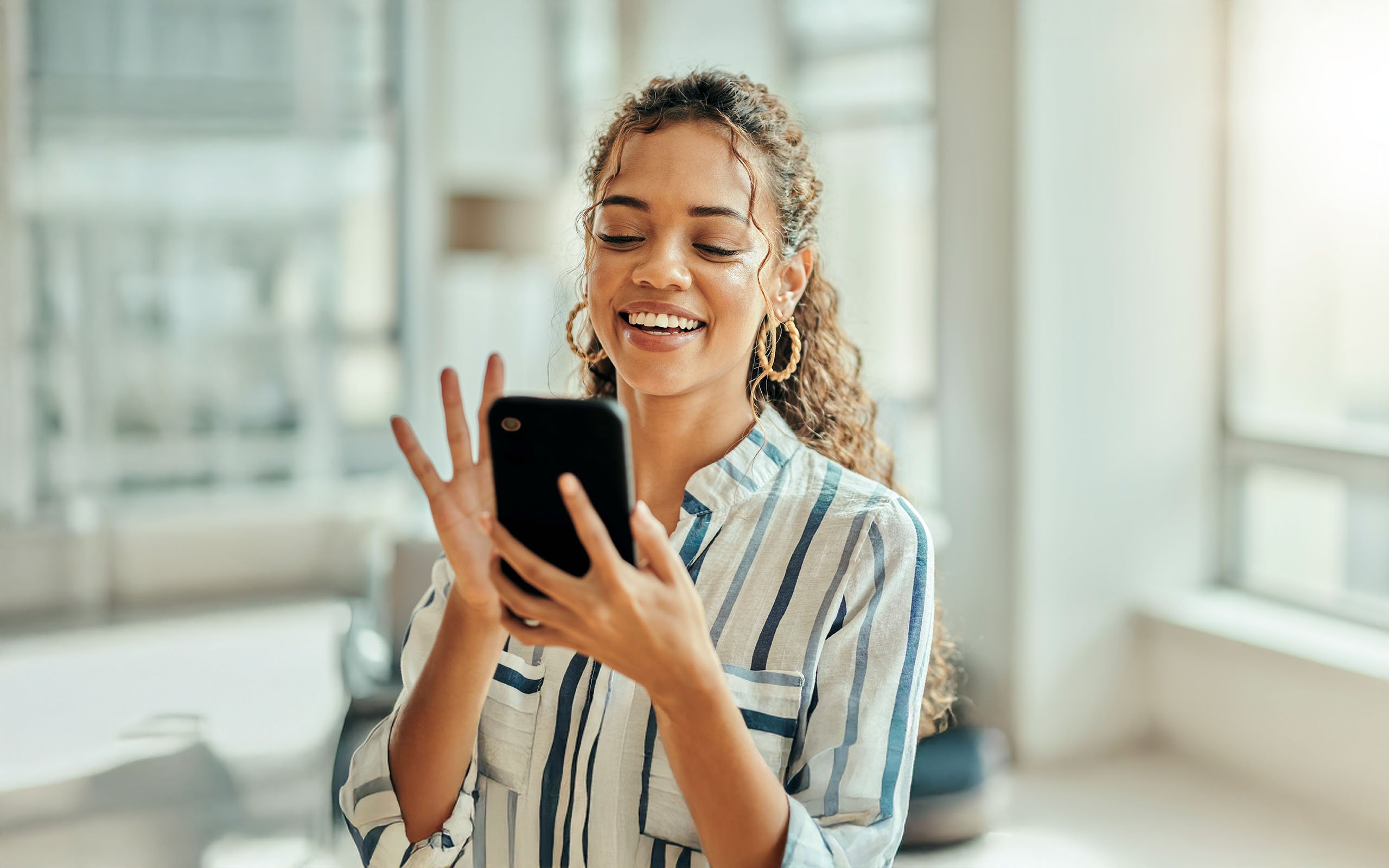 Woman typing on a phone