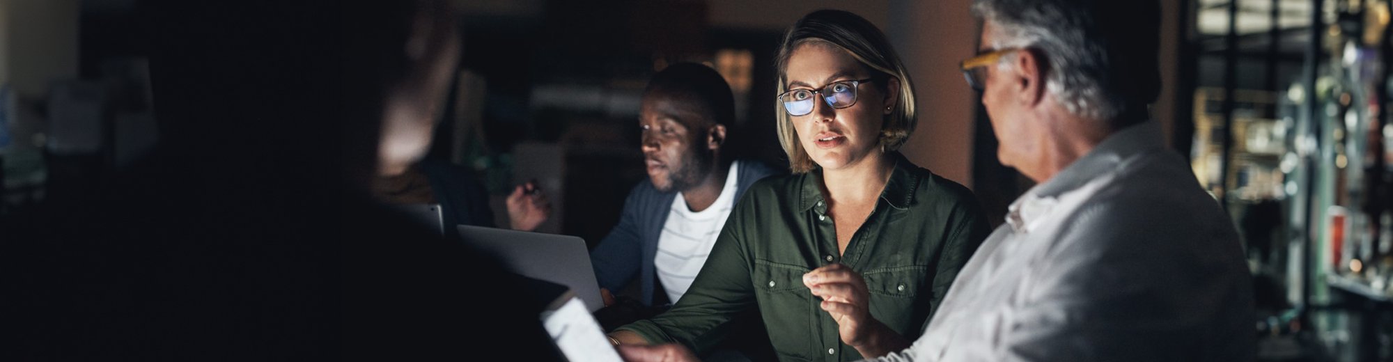 Woman in a strategy meeting talking to her colleagues